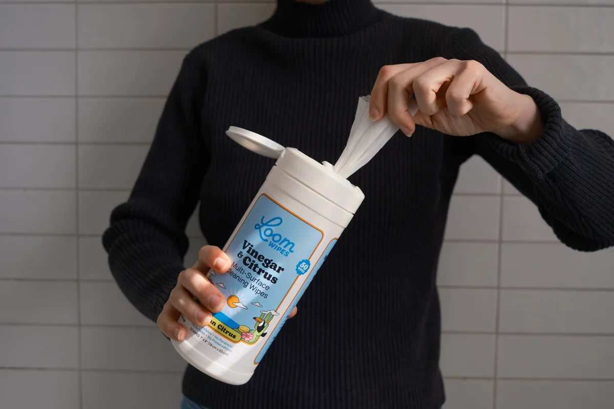 Pulling a wipe from the Loom Wipes canister
