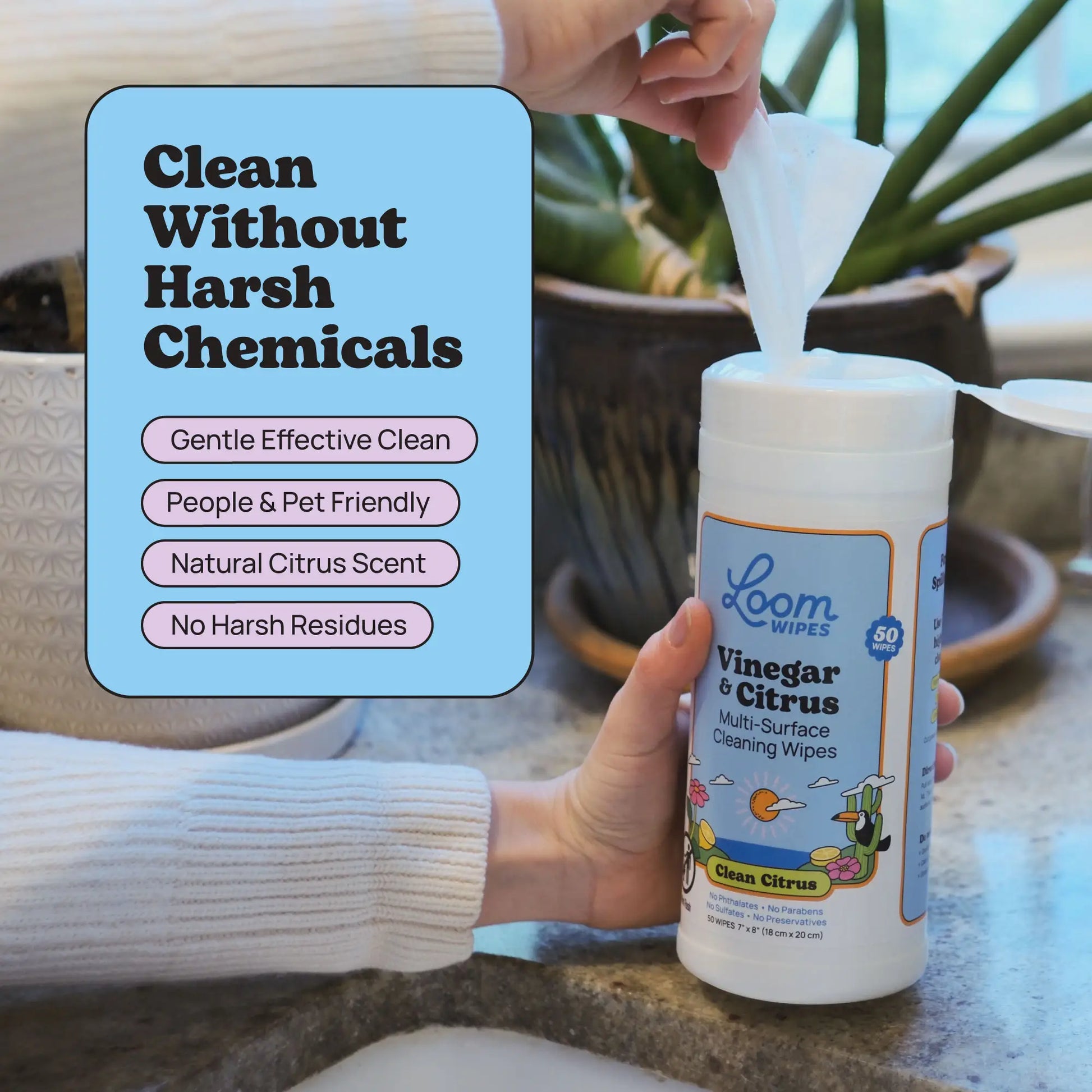 Person using Loom Vinegar Wipes on a surface with text highlighting benefits
