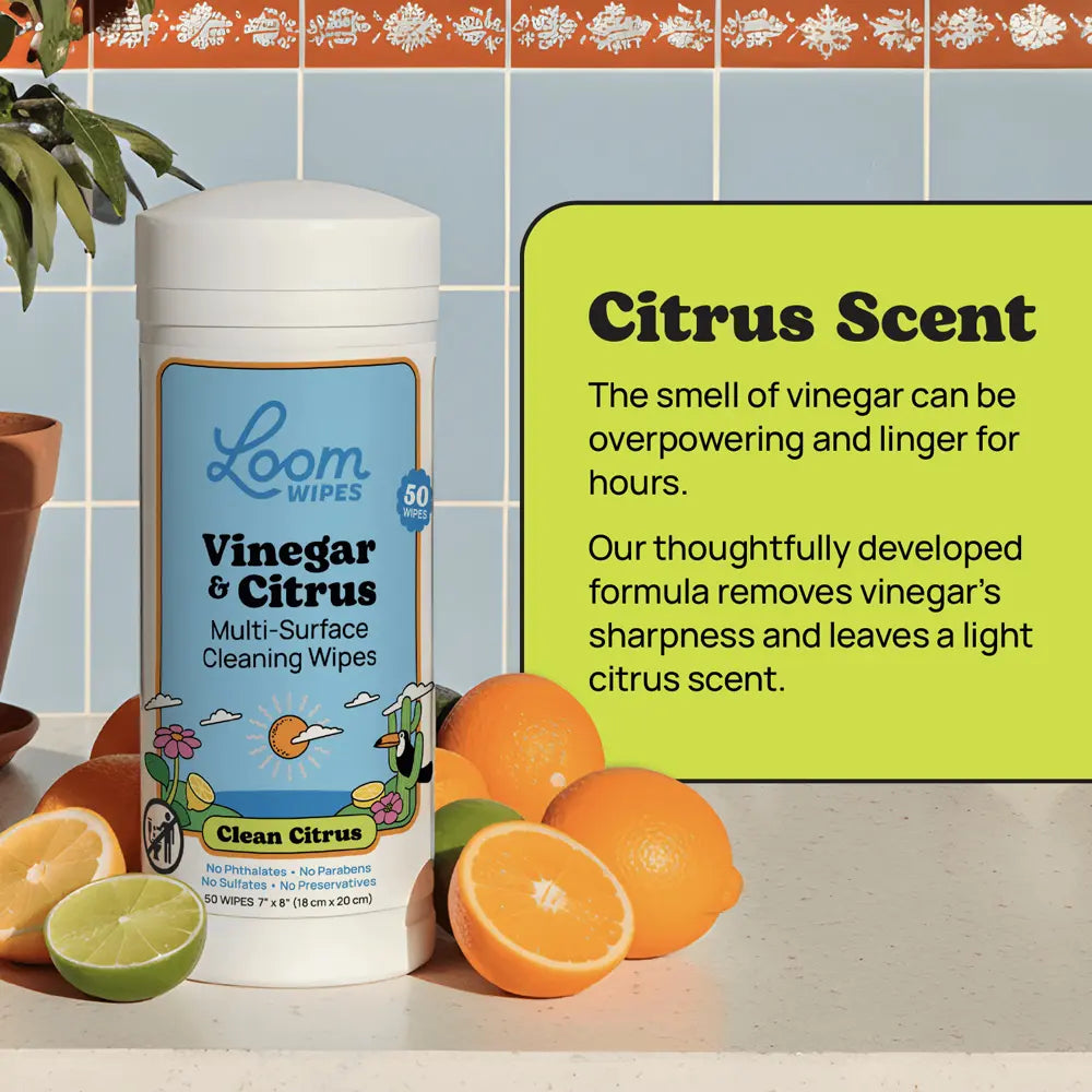 Loom Vinegar & Citrus cleaning wipes with oranges and a green label on a tiled wall background