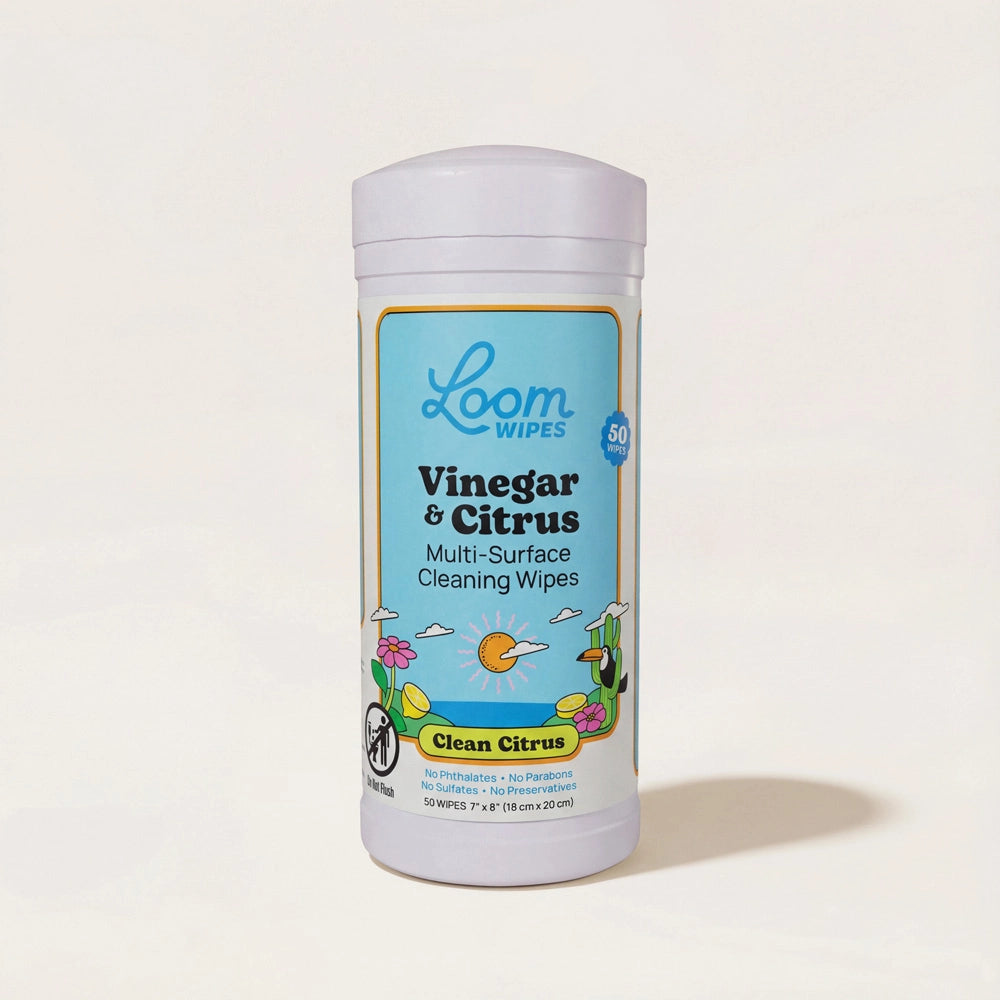 Loom Wipes container with vinegar and citrus scent on a light beige background
