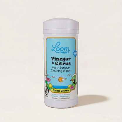 Loom Wipes container with vinegar and citrus scent on a light beige background